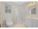 Neutral bathroom with walk-in shower, vanity, and window at 121 Arrowridge Ct, Summerville, SC 29485