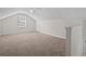 Upstairs bedroom features neutral carpet, a ceiling fan, and natural light at 121 Arrowridge Ct, Summerville, SC 29485