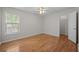 Bright bedroom features hardwood floors, ceiling fan, closet, and natural light at 121 Arrowridge Ct, Summerville, SC 29485