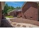 Brick home with manicured yard featuring a stone pathway and well-maintained landscaping at 121 Arrowridge Ct, Summerville, SC 29485