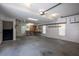 Spacious garage interior with a workbench, storage and stairs to another level at 121 Arrowridge Ct, Summerville, SC 29485