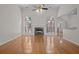 Spacious living room featuring hardwood floors, fireplace, and arched windows at 121 Arrowridge Ct, Summerville, SC 29485