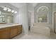 Bright main bathroom features a soaking tub, separate shower, and double sink vanity at 121 Arrowridge Ct, Summerville, SC 29485