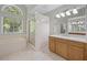 Bright main bathroom with a soaking tub, walk-in shower, and dual sink vanity at 121 Arrowridge Ct, Summerville, SC 29485