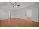 Spacious main bedroom featuring hardwood floors, ceiling fan, and plenty of natural light at 121 Arrowridge Ct, Summerville, SC 29485