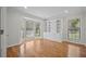 Bright home office with built-in shelving and bay windows at 121 Arrowridge Ct, Summerville, SC 29485
