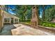 Backyard oasis featuring a brick outdoor fireplace and screened-in porch at 122 Mellard Dr, Goose Creek, SC 29445
