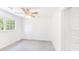 Bright bedroom featuring a ceiling fan, carpet, and built-in shelving at 122 Mellard Dr, Goose Creek, SC 29445