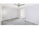Neutral bedroom with a ceiling fan and a large window at 122 Mellard Dr, Goose Creek, SC 29445