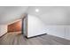 Bonus room features a brick wall and a sliding barn door to a bathroom at 122 Mellard Dr, Goose Creek, SC 29445