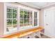 Charming entryway featuring a built-in bench with storage and a large window framing the backyard at 122 Mellard Dr, Goose Creek, SC 29445