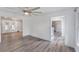 Open living room with gray walls, LVP flooring, and views to the entryway, kitchen, and outdoor porch at 122 Mellard Dr, Goose Creek, SC 29445