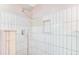 Modern shower with rainfall shower head, built-in niche, and stylish white tiling at 122 Mellard Dr, Goose Creek, SC 29445