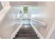 Stairway to walkout basement with backyard access and plenty of natural light at 122 Mellard Dr, Goose Creek, SC 29445