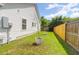 Spacious backyard showcasing a wooden fence and a grassy area, perfect for outdoor activities at 1287 Chatfield St, Mount Pleasant, SC 29464