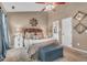 Comfortable primary bedroom with a ceiling fan and views to the en suite bathroom at 1287 Chatfield St, Mount Pleasant, SC 29464