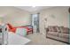 Inviting bedroom with a cozy seating area and a view of the outdoors at 1287 Chatfield St, Mount Pleasant, SC 29464
