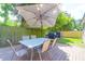 Outdoor deck featuring a dining table with umbrella, and grill for backyard entertaining at 1287 Chatfield St, Mount Pleasant, SC 29464
