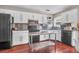 Modern kitchen with stainless steel appliances, white cabinets, and ample counter space at 1287 Chatfield St, Mount Pleasant, SC 29464