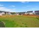 Large, fenced backyard with lush grass and ample space for recreation in a Gathering-friendly neighborhood at 130 Spotted Way, Summerville, SC 29485