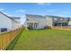 Large backyard with a well-maintained lawn and fenced perimeter, offering a perfect outdoor space at 130 Spotted Way, Summerville, SC 29485