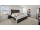 Bright bedroom showcasing a modern wood bed, white bedding, shelving unit, and natural light at 130 Spotted Way, Summerville, SC 29485