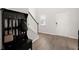Bright foyer with hardwood flooring, staircase, hall tree, and front door at 130 Spotted Way, Summerville, SC 29485