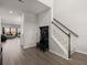 Inviting foyer featuring wood floors, coat rack, and a staircase leading to the upper level at 130 Spotted Way, Summerville, SC 29485