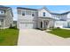 Beautiful exterior view of the two-story home featuring a garage and inviting curb appeal at 130 Spotted Way, Summerville, SC 29485