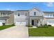 Charming two-story home with a well-manicured lawn and attached garage at 130 Spotted Way, Summerville, SC 29485