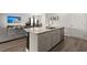 Island in open kitchen, granite counters, stainless dishwasher, view to living and dining area at 130 Spotted Way, Summerville, SC 29485