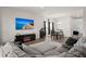 Inviting living area featuring a sectional sofa, fireplace, entertainment center, and dining set at 130 Spotted Way, Summerville, SC 29485