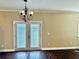 Dining Room with Hardwood floors, decorative chandelier and french doors with blinds at 1333 Song Sparrow Way, Hanahan, SC 29410