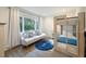 bedroom featuring bunkbeds, a cozy daybed, large windows, and a blue rug at 1365 Dunlin Ct # F, Kiawah Island, SC 29455