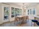 Dining room boasting natural light, golf course views, and modern light fixture at 1365 Dunlin Ct # F, Kiawah Island, SC 29455