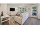 Bright living room with hardwood floors, large windows, and stylish decor at 1365 Dunlin Ct # F, Kiawah Island, SC 29455