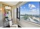 Charming balcony space with chair, mirror and lake view with large window at 14 Lockwood Dr # 4C, Charleston, SC 29401