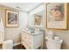 Bathroom featuring a granite countertop, vanity, toilet and illuminated mirror at 14 Lockwood Dr # 4C, Charleston, SC 29401