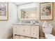 Bathroom featuring a granite countertop, vanity and illuminated mirror at 14 Lockwood Dr # 4C, Charleston, SC 29401