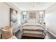 Bedroom with artwork features ceiling fan, large windows, and stylish decor at 14 Lockwood Dr # 4C, Charleston, SC 29401