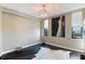 Spacious room with sleek lighting, modern artwork, and lots of natural light from two windows at 14 Lockwood Dr # 4C, Charleston, SC 29401