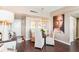 Dining area with modern lighting, a glass table, and an elegant Personal painting on the wall at 14 Lockwood Dr # 4C, Charleston, SC 29401