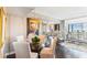 Cozy dining area with a glass table, pendant lighting, and elegant decor at 14 Lockwood Dr # 4C, Charleston, SC 29401
