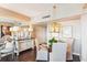 Bright dining room with a glass table, closet space, and modern pendant lighting at 14 Lockwood Dr # 4C, Charleston, SC 29401