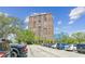 Exterior view of a high-rise building with ample parking on a beautiful sunny day at 14 Lockwood Dr # 4C, Charleston, SC 29401
