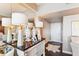 Hallway featuring a dark wood accent table with bright white lamps and storage closet at 14 Lockwood Dr # 4C, Charleston, SC 29401