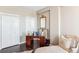 Hallway leading to bedroom with two closets, hardwood floors, and stylish desk at 14 Lockwood Dr # 4C, Charleston, SC 29401