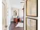 Hallway leading to a bedroom features dark wood floors and distinctive decor at 14 Lockwood Dr # 4C, Charleston, SC 29401