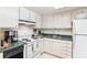 Functional kitchen offers white appliances, ample storage, and streamlined food preparation at 14 Lockwood Dr # 4C, Charleston, SC 29401