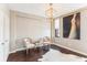Bright living room featuring stylish decor, light beige walls and hardwood floors at 14 Lockwood Dr # 4C, Charleston, SC 29401